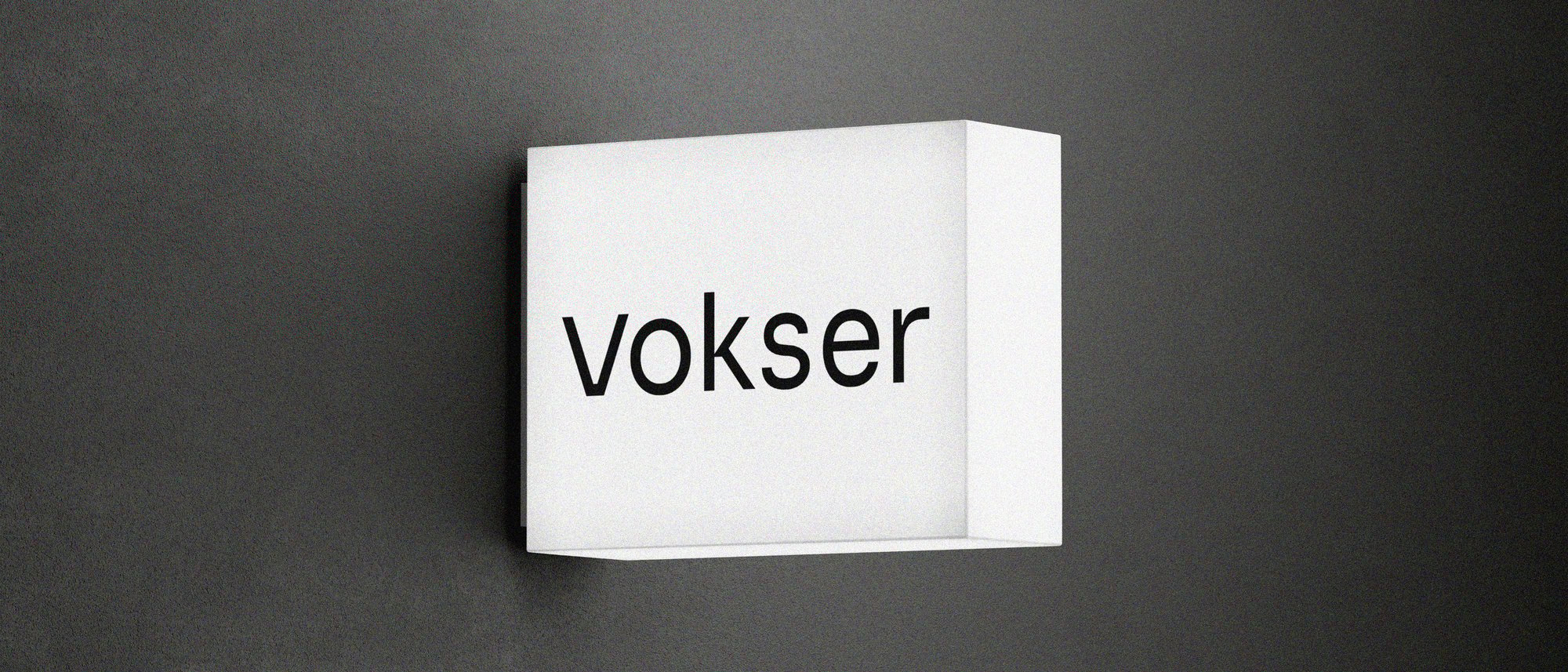 Veggskilt med ny logo for Vokser